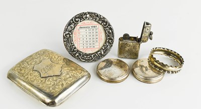Lot 27 - A silver petrol lighter with engraved...