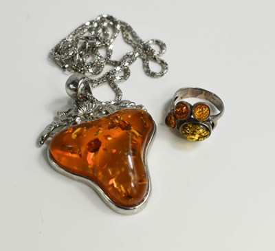 Lot 66 - An Amber style strawberry shaped pendant and...