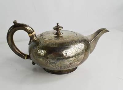 Lot 325 - A silver tea pot, engraved with decoration to...