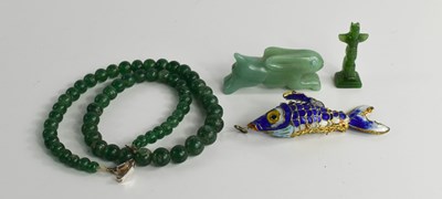 Lot 69 - A Chinese spinach green jade beaded necklace,...