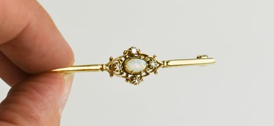 Lot 121 - A 9ct gold, opal and diamond brooch.