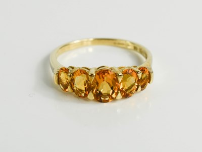 Lot 128 - A 9ct gold and citrine ring, the five oval cut...