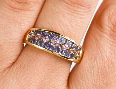 Lot 129 - A 9ct gold, tanzanie and pink sapphire ring,...