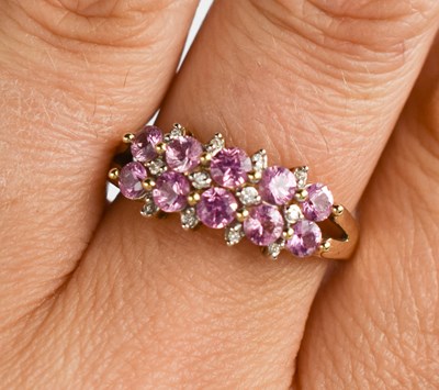 Lot 131 - A 9ct gold, pink sapphire and diamond ring,...