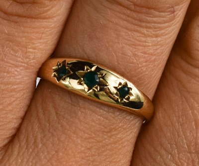 Lot 144 - A 9ct gold and emerald gypsy style ring, size...