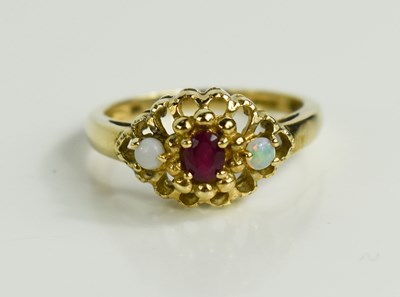 Lot 145 - A 9ct gold opal and ruby three stone ring,...