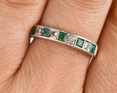 Lot 146 - A 9ct gold emerald and diamond ring, size R, 2....