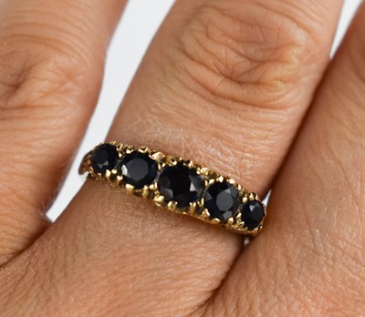 Lot 142 - A 9ct gold and sapphire Victorian style ring,...