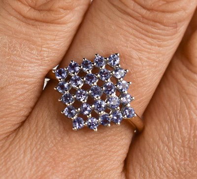 Lot 123 - A 9ct gold, tanzanite square cluster ring,...