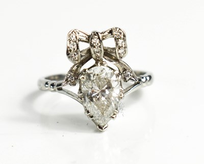 Lot 168 - A stunning pear cut diamond ring, surmounted...