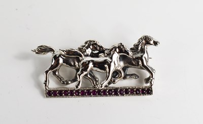 Lot 96 - A silver brooch in the form of three horses on...