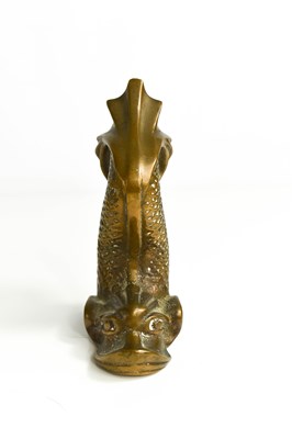 Lot 8 - A small bronze ornament in the form of a...