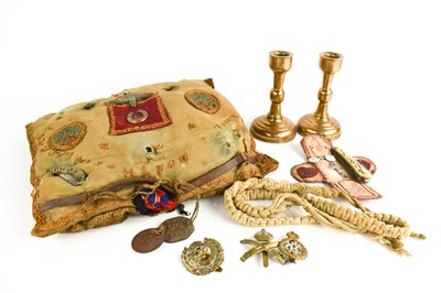 Lot 295 - A WWI pillow and cap badges to Harold Couzens,...