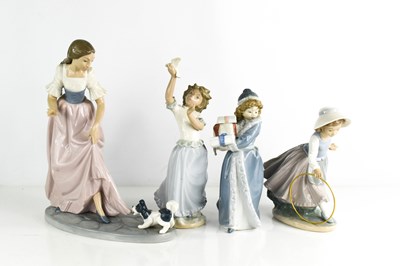 Lot 47 - A large Nao porcelain figure group of a girl...