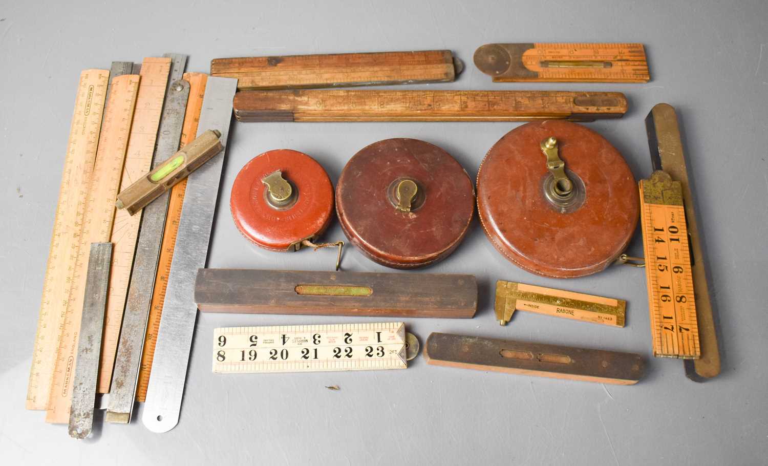 Old Level Ruler Image Lot 344 - A group of vintage levels, rulers and tape