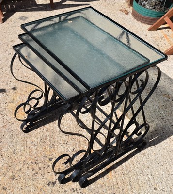 Lot 361 - A nest of three painted black metal tables...