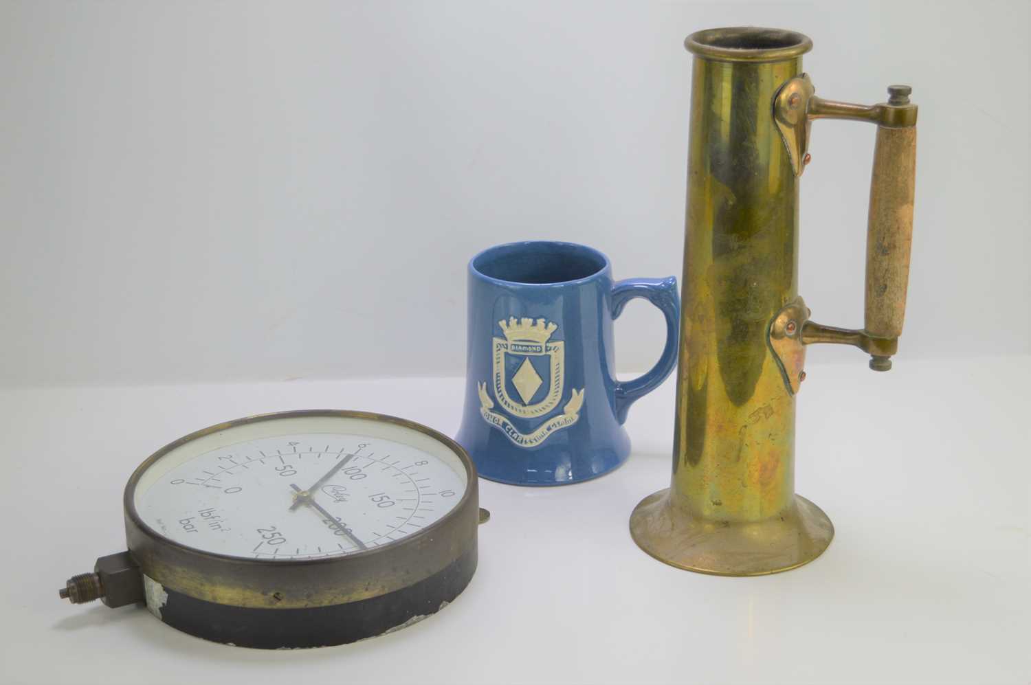 Lot 218 - A brass tankard made from a shell together...