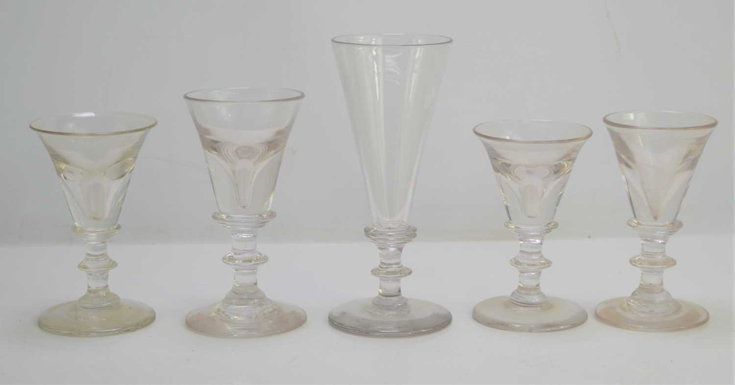 Lot 329 - Four Georgian baluster form toasting glasses...