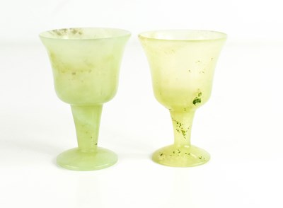 Lot 107 - A pair of pale green Jade carved sake cups,...