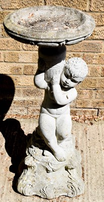 Lot 481 - A cast stoneware bird-bath with cherub support.