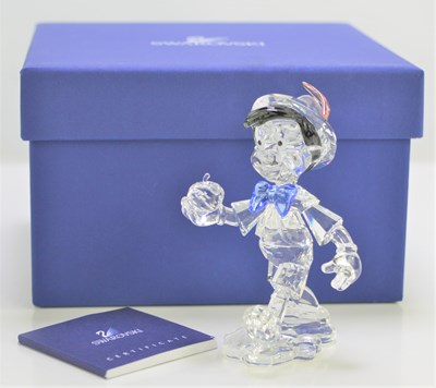 Lot 124 - A Swarovski Disney "Pinocchio" figure with...