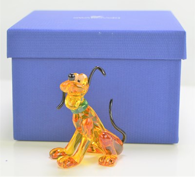 Lot 128 - A Swarovski Disney "Pluto" figure, coloured...