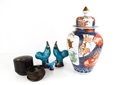 Lot 30 - Three pottery Chinese cockerels, in blue glaze,...