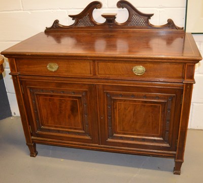 Lot 384 - An Edwardian mahogany sideboard with a shaped...