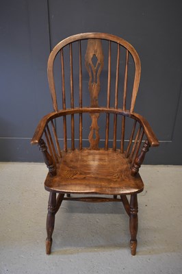 Lot 394 - A 19th century elm Windsor armchair, the hoop...