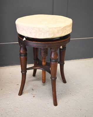 Lot 393 - A 19th century mahogany piano stool with...