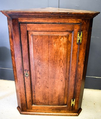 Lot 374 - A 19th century oak corner cupboard with a...