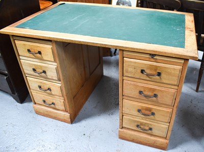 Lot 387 - A 1970s twin pedestal desk with two banks of...