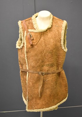 Lot 296 - An early 20th century sheepskin jerkin,...