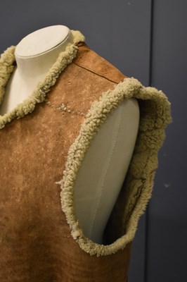 Lot 296 - An early 20th century sheepskin jerkin,...