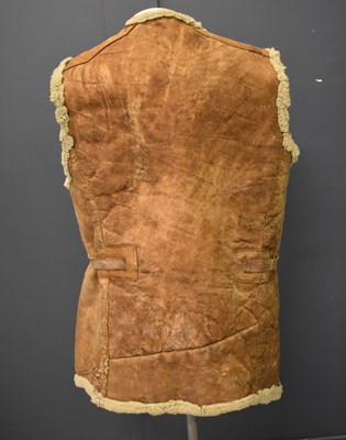 Lot 296 - An early 20th century sheepskin jerkin,...