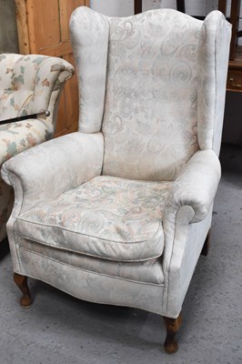 Lot 389 - An antique wingback armchair, mahogany frame...