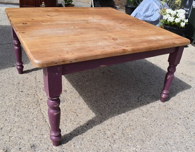 Lot 653 - A modern pine dining table with baluster form...