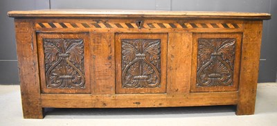 Lot 656 - A 17th century oak coffer with candle box...