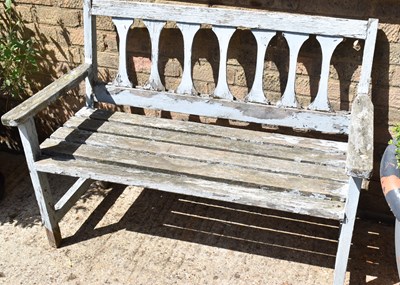 Lot 452 - A small antique wooden bench with residual...