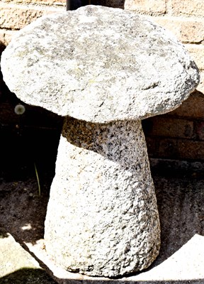 Lot 473 - An antique granite saddle stone.