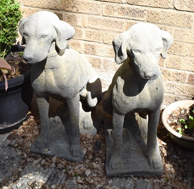 Lot 485 - A pair of reconstituted stone dogs, seated...