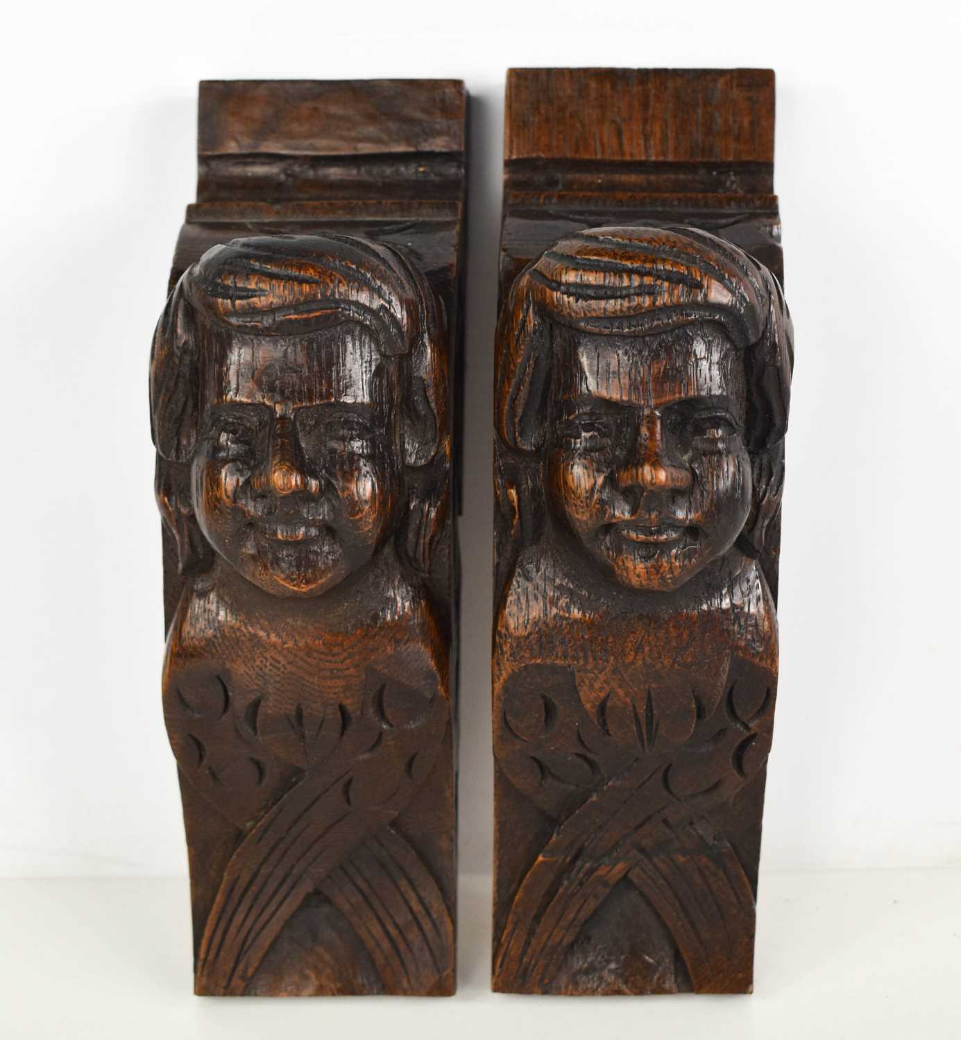 Lot 439 - A pair of oak early 19th century carved...