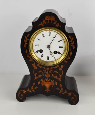 Lot 215 - A 19th century French marquetry mantle clock,...