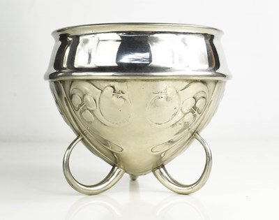 Lot 34 - An Archibald Knox pewter bowl raised on three...