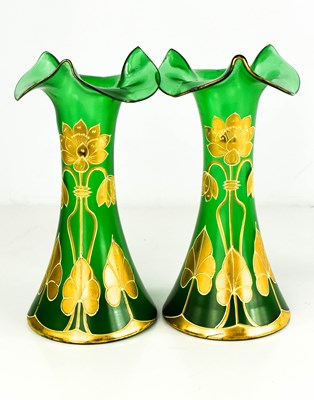 Lot 67 - A pair of Art Nouveau green glass vases with...