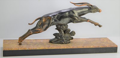 Lot 38 - An Art Deco spelter leaping gazelle signed...