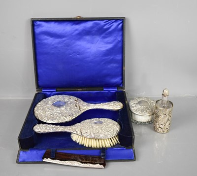 Lot 421 - A silver backed dressing table set of mirror,...