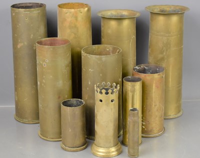 Lot 482 - A group of WW1 and WWII brass trench art shells.