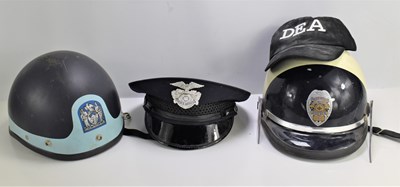 Lot 313 - Three original American police helmets and...