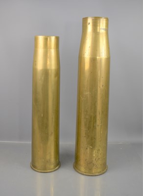 Lot 296 - Two large brass shell cases, the tallest being...